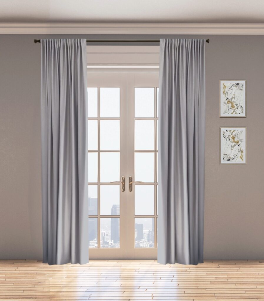 Light taupe curtains over glass doors.