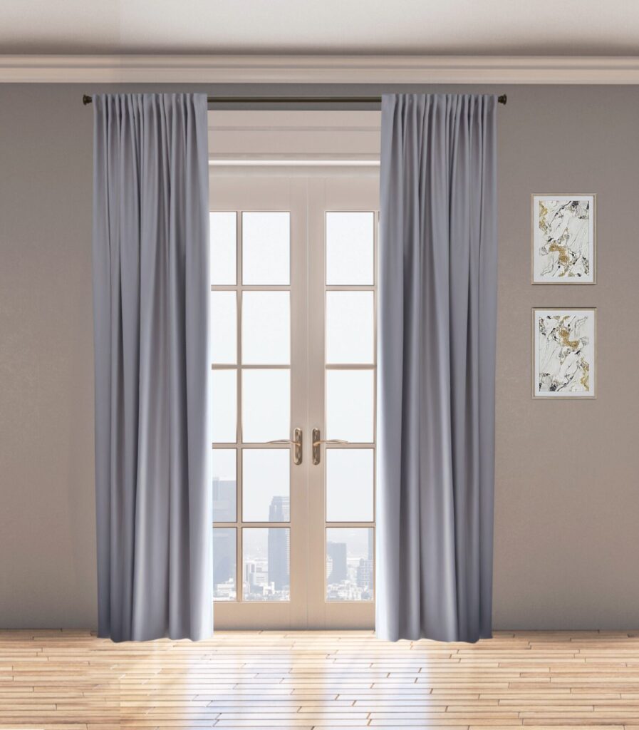 A Pair Of Gray Curtains Hangs On A Rod In Front Of A Large Window With Glass Panes And A View Of A City Skyline. Two Framed Abstract Art Pieces Are On The Light Gray Wall.