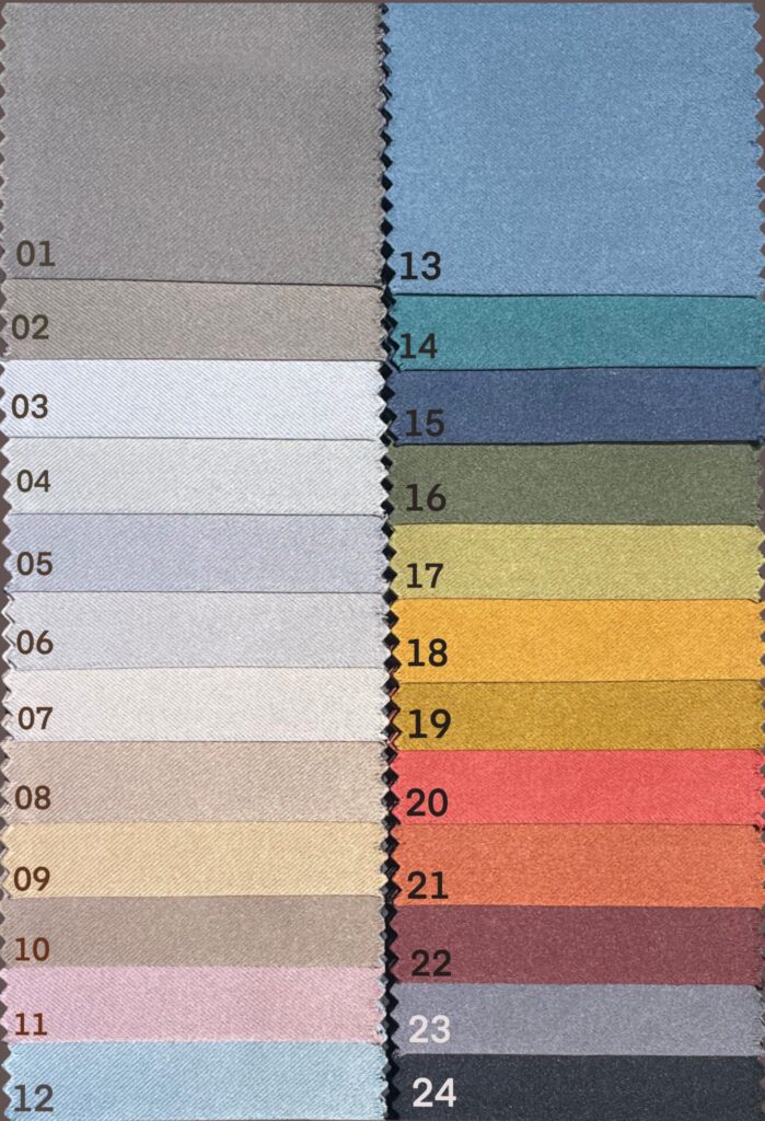 A FilFabric fabric swatch card showing curtain material samples in a range of colors.